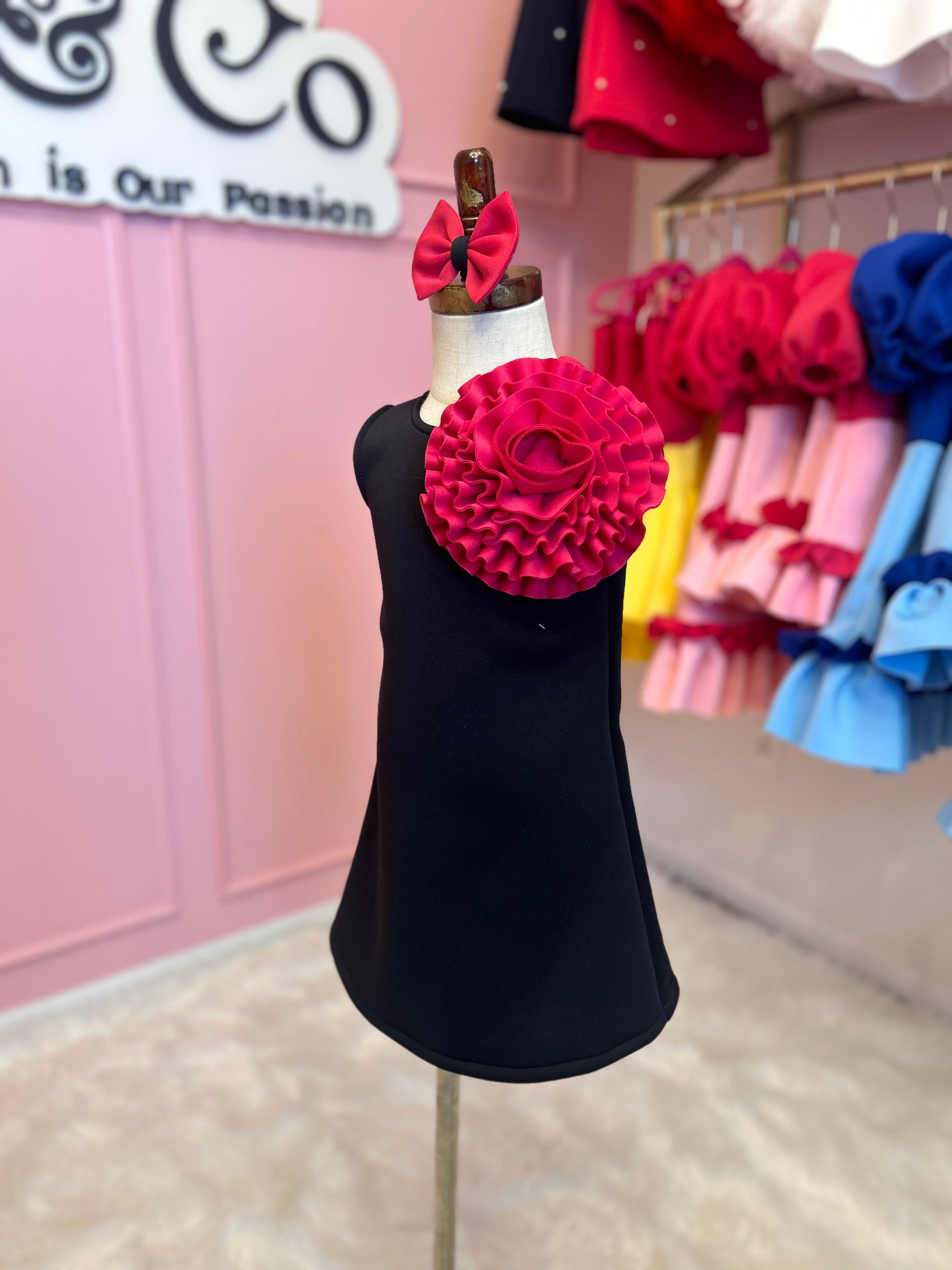 Sleeveless A-line floret dress displayed on stand