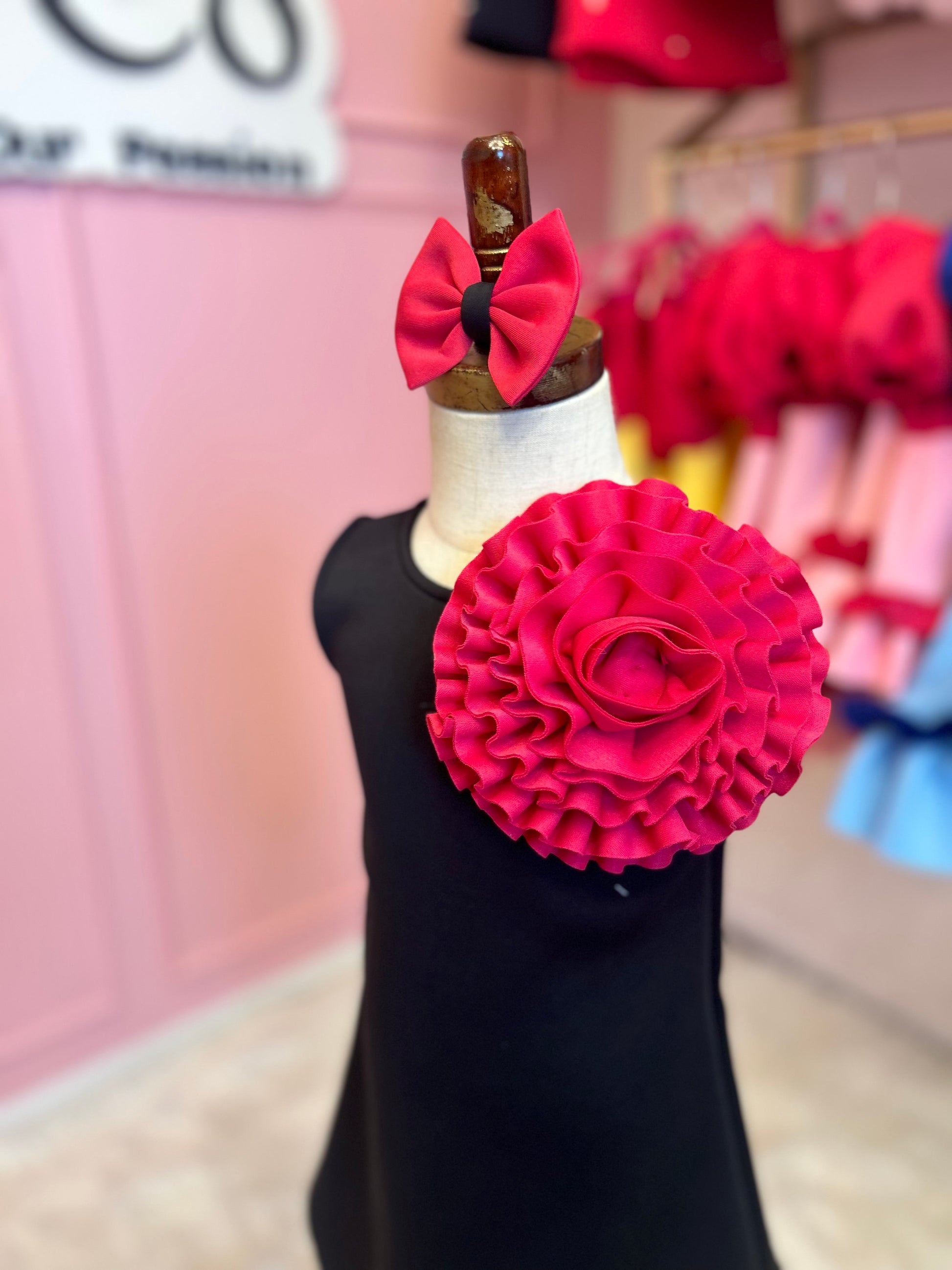 Sleeveless A-line floret dress displayed on stand