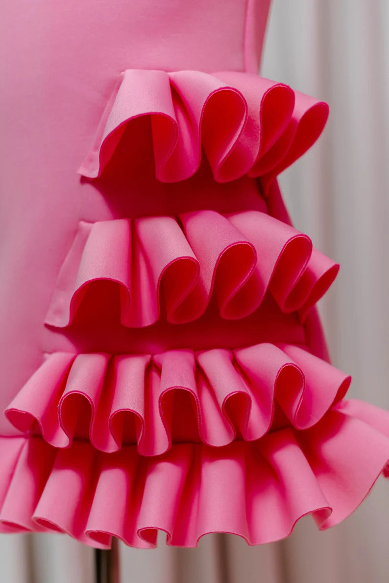 close up of Ruffles on pink dress