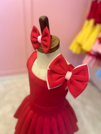 side view of Rear view of Two-piece dress with a bow strap displayed on a fashion stand.