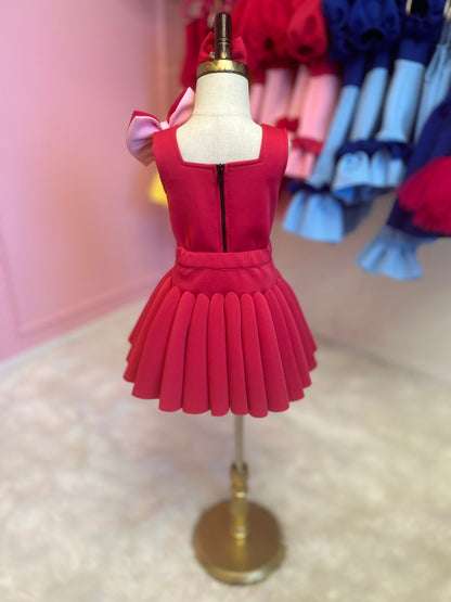 Rear view of Two-piece dress with a bow strap displayed on a fashion stand.