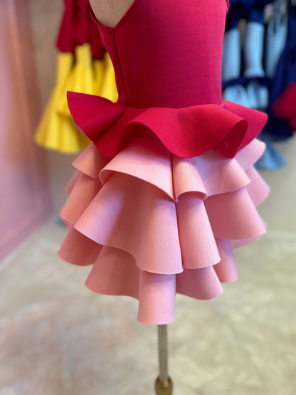 pleated bottom of ruffle dress displayed on fashion stand